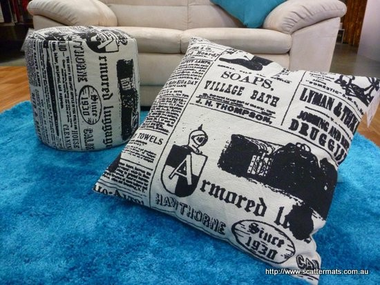 cushion pouffe foot stool in old news print black and cream in a cotton canvas material